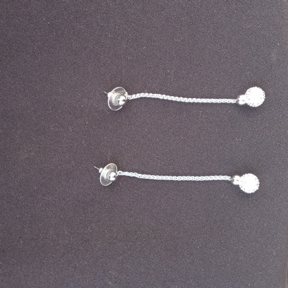 **Crystal and silver tone dangling earrings